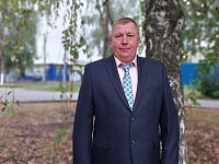 Портрет главы крестьянско-фермерского хозяйства Юрия Михайловича Болтышева на районной Доске почёта